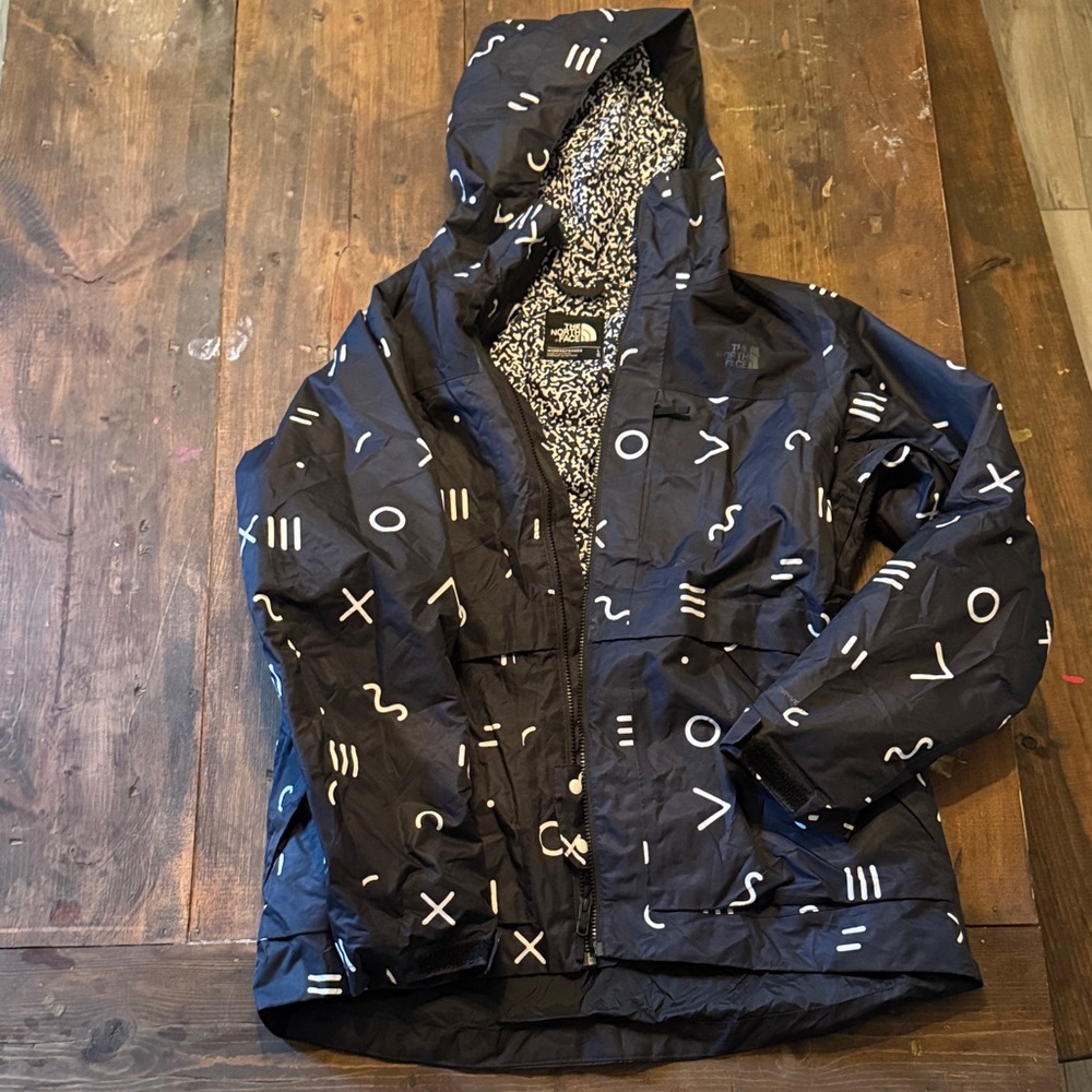 The North Face Black Jacket with White Symbols